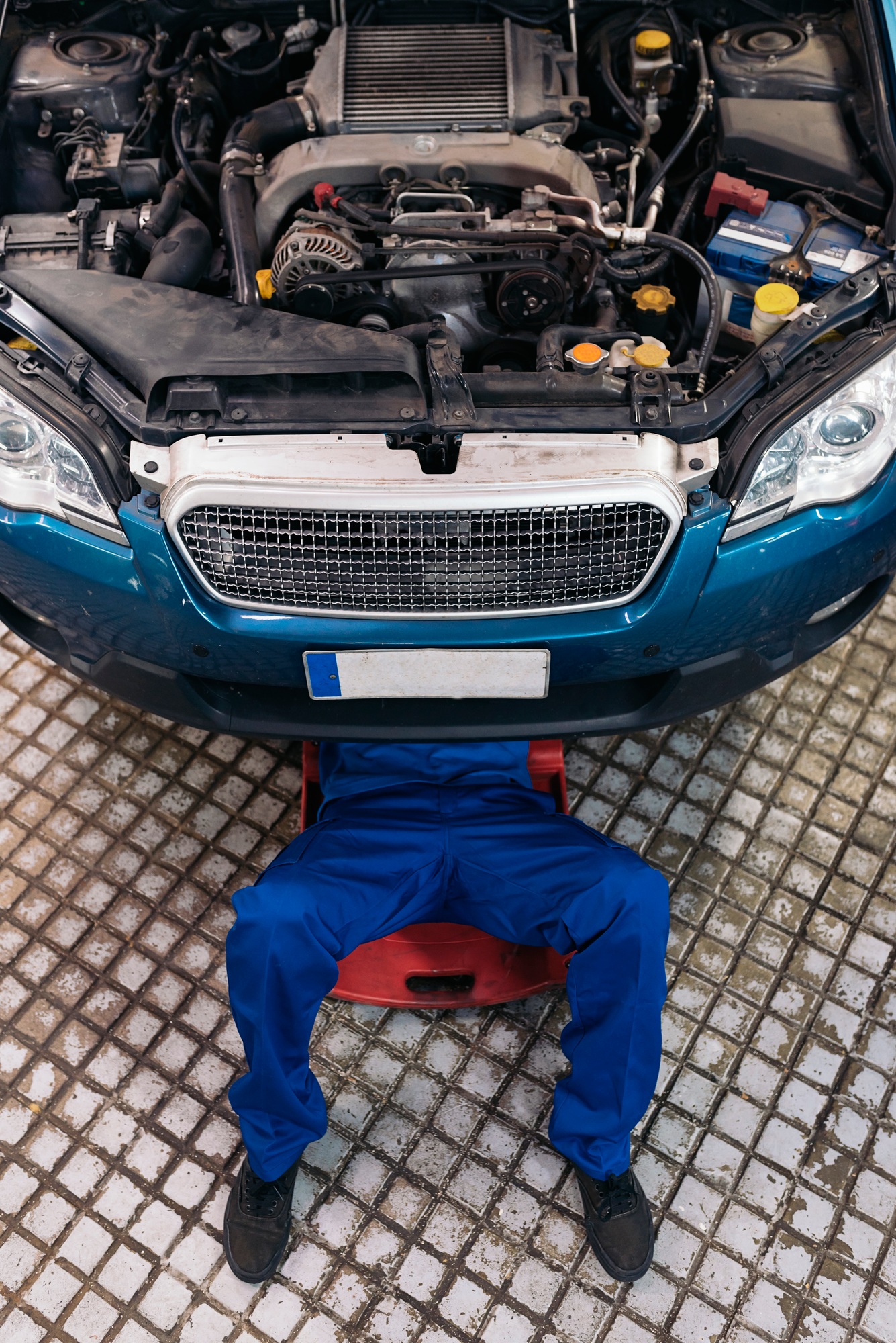 Professional Mechanic Repairing Car.